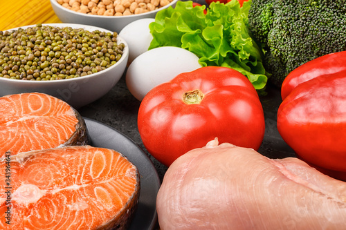 Tomatoes, chickpeas, salmon and vegetables close-up. A set of products for a flexible diet