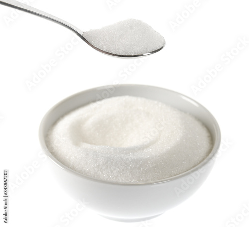 Ceramic bowl with sugar and teaspoon isolated on white background