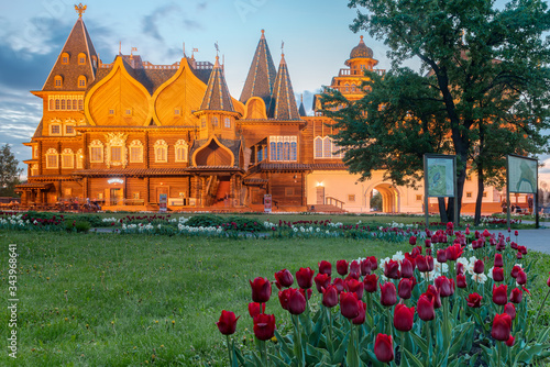 Palace of Tsar Alexey Mikhailovich Romanov in Kolomenskoye. Spring blooming of tulips. The inscription on the building 