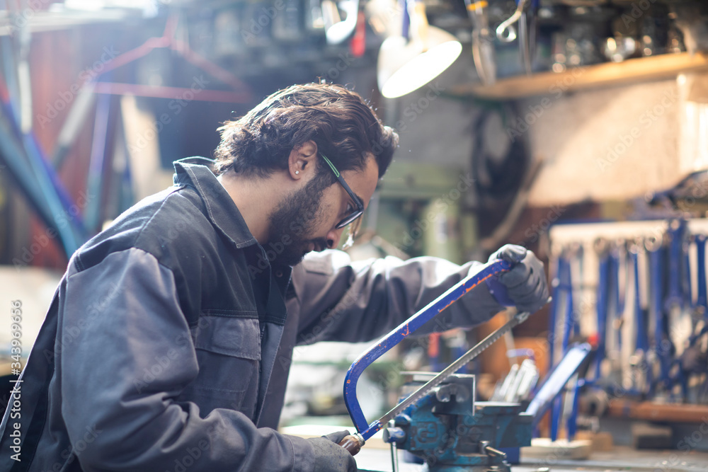 young plumber technician working in workshop young plumber technician working in workshop