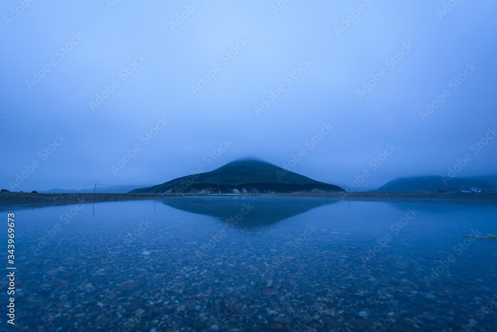 Long exposure of reflection of mountain in water at night Long exposure of reflection of mountain in water at night