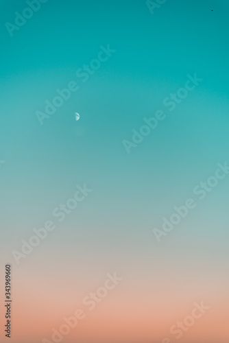 Gradient sky at sunset with Moon photo