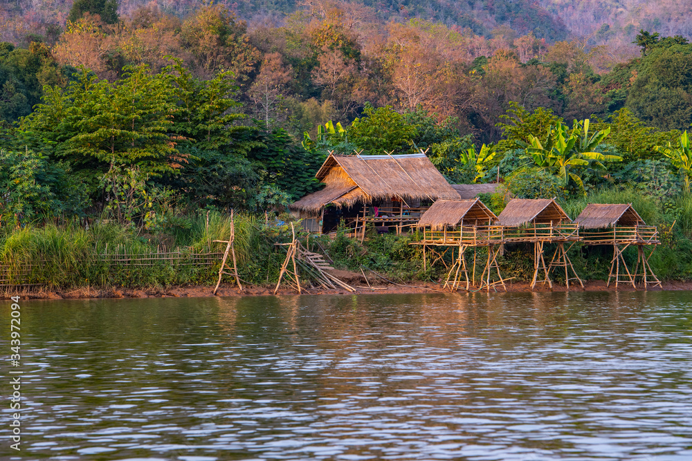 simple house along the Mekong River in Laos simple house along the Mekong River in Laos