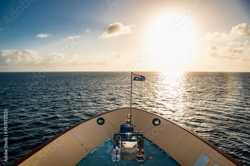 Australian exploration vessel heading into the setting sun