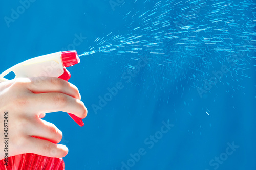 Fotografie Spray atomizer in female hand