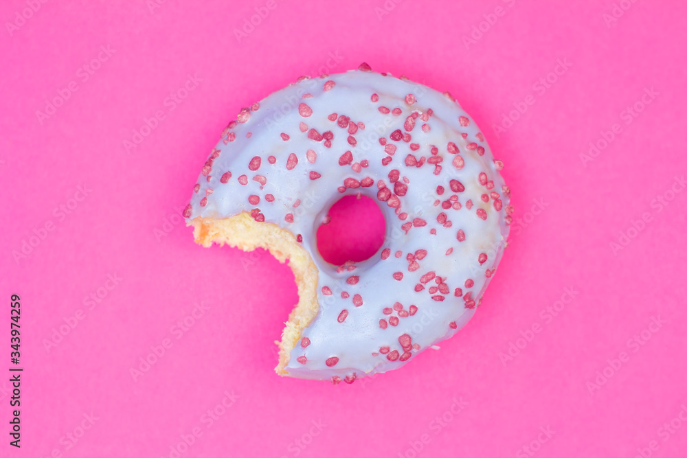 Sweet blue donut on pink background. Dessert food Sweet blue donut on pink background. Dessert food