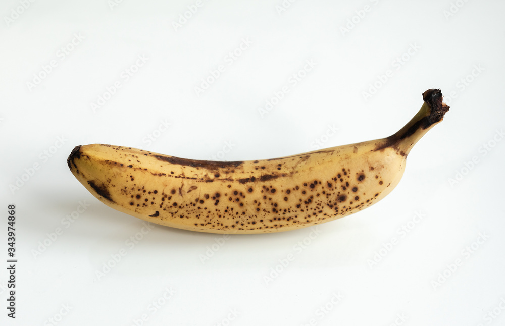View of an isolated ripped banana with white background View of an isolated ripped banana with white background