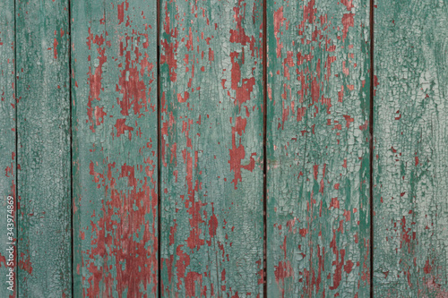 Green with red textured background with painted cracked wood © Дмитрий Шкода