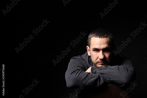 picture of a man on a black background in black clothes
