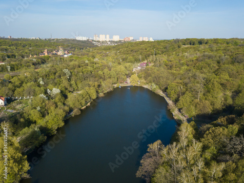 Forest lake on a spring day. Aerial drone view.