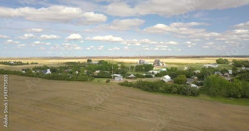 Small Canadian town in the middle of nowhere prairies and fields  Saskatchewan Manitoba Hazlet farming 4K flying drone aerial