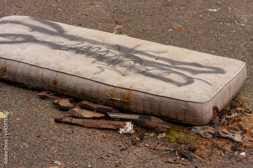 homeless worn and abandoned mattress