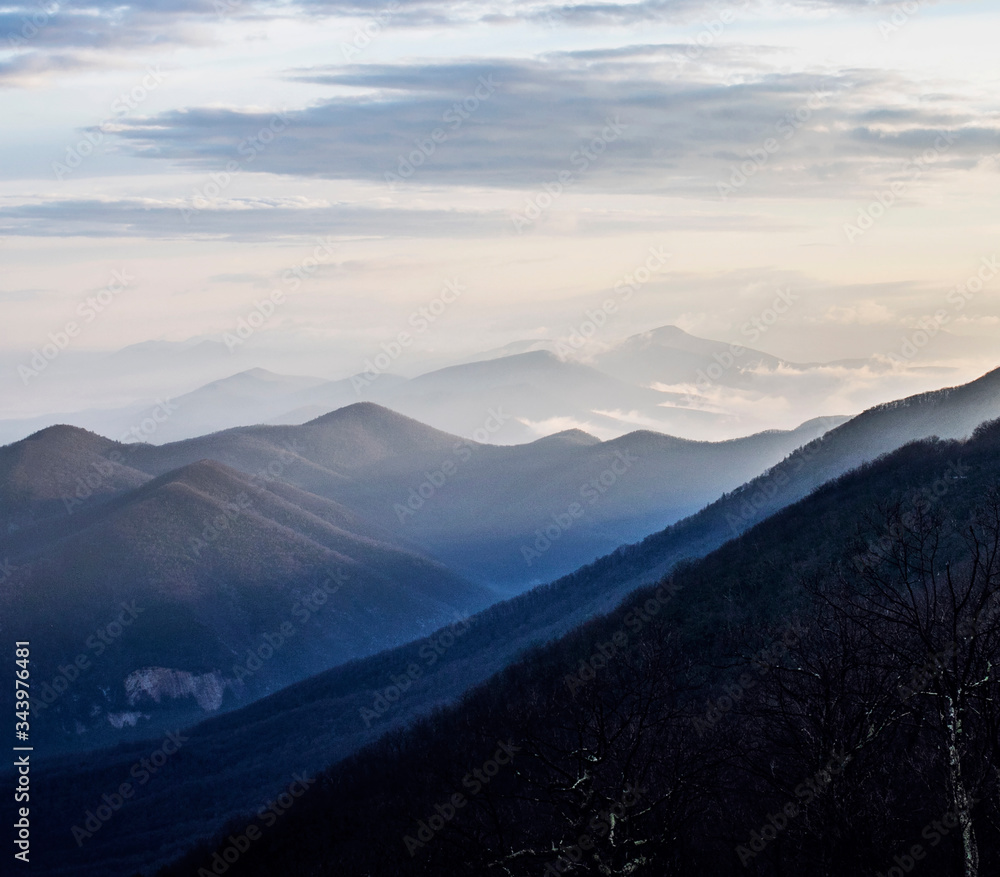 sunrise hits the tops of mountains along the Blue Ridge Parkway sunrise hits the tops of mountains along the Blue Ridge Parkway
