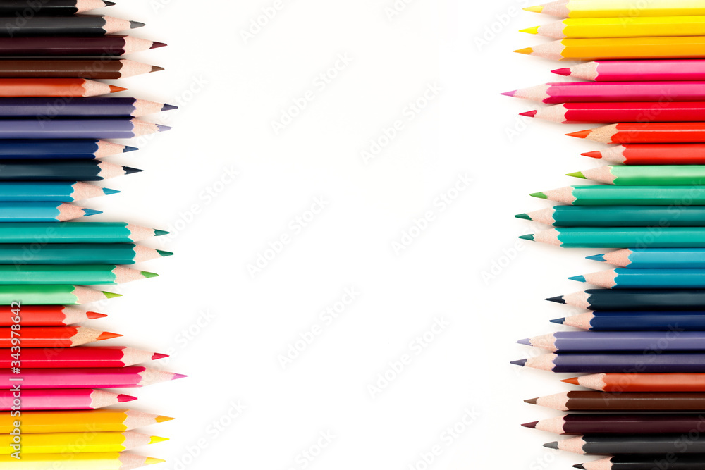 Fototapeta premium Color pencils on a white background in a row, creativity concept.