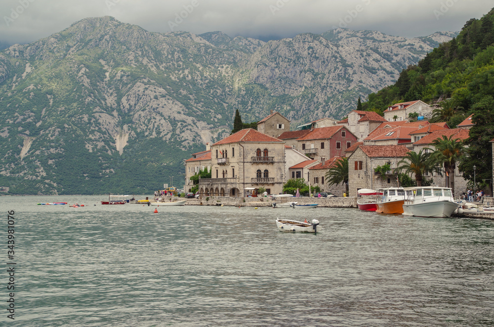 Shore of Perast. Cloudy day in the old town on the Bay of Kotor. Nature and travel. Montenegro, Perast
