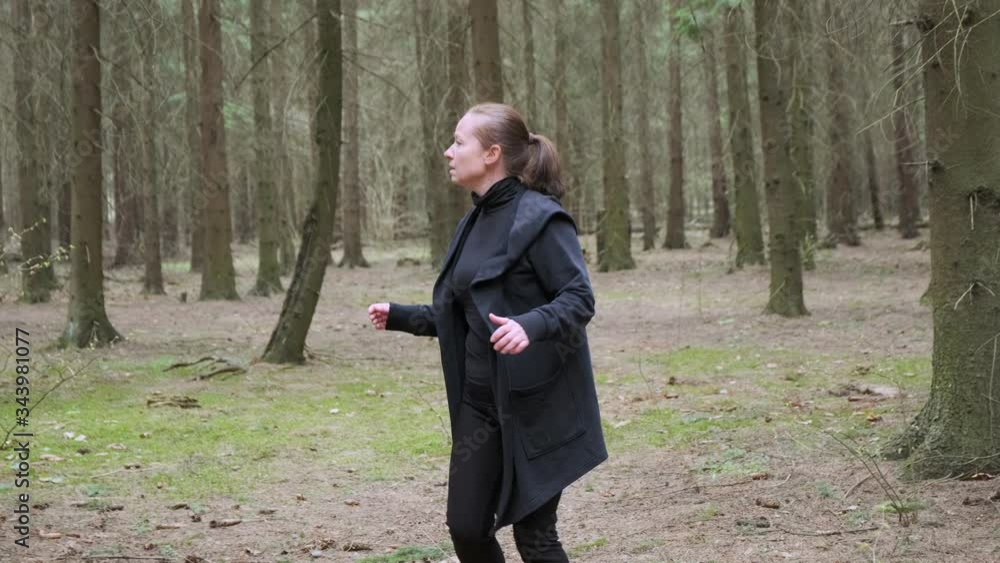 Lost woman in forest in panic rushing around looking for way out. Lost woman in forest in panic rushing around looking for way out.