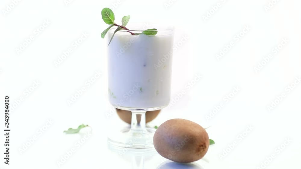 Homemade sweet yogurt with slices of ripe green kiwi in a glass Homemade sweet yogurt with slices of ripe green kiwi in a glass