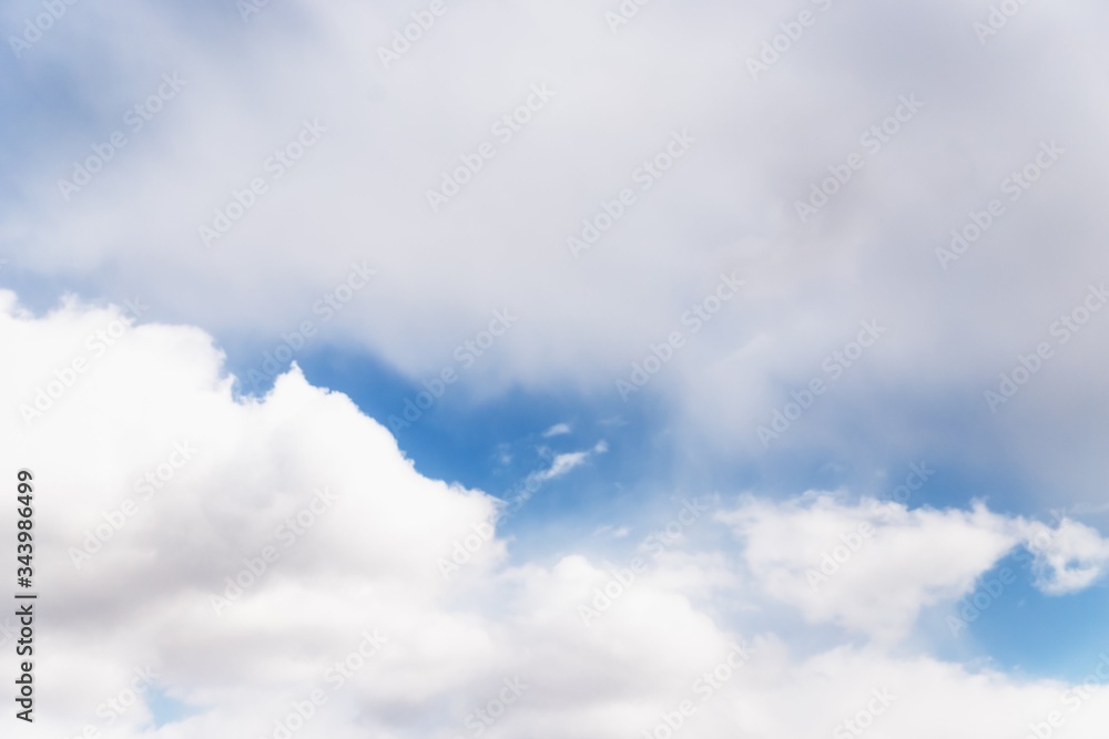 Fototapeta premium Scenic sky background. Blue sky with fluffy white clouds