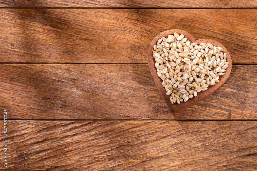Raw Organic Pearl Barley - Hordeum vulgare. heart shaped bowl Raw Organic Pearl Barley - Hordeum vulgare. heart shaped bowl