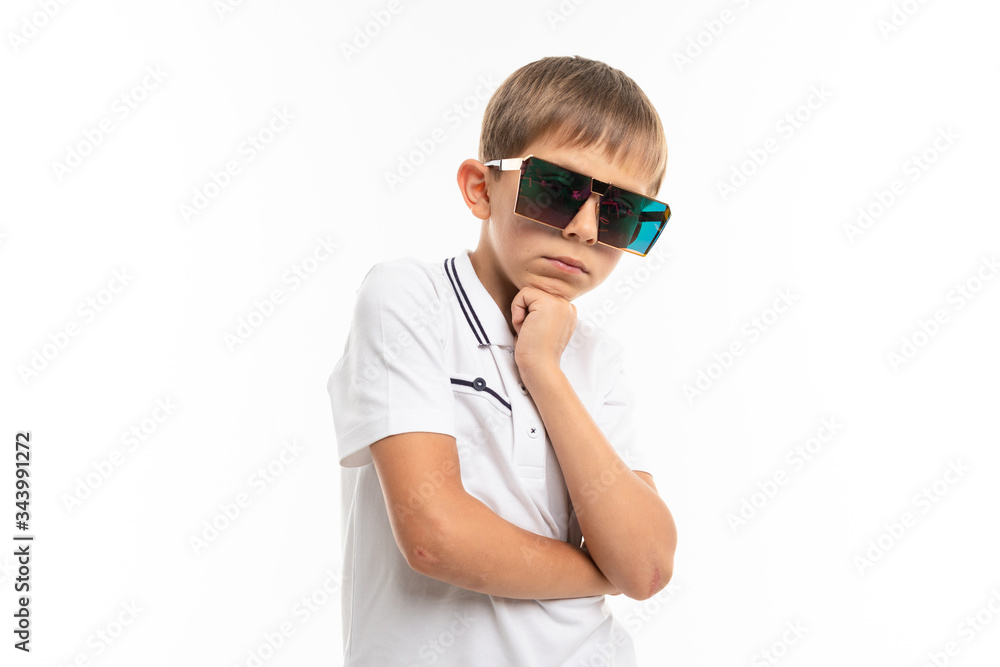 Young caucasian teenager in big sunglasses on white background