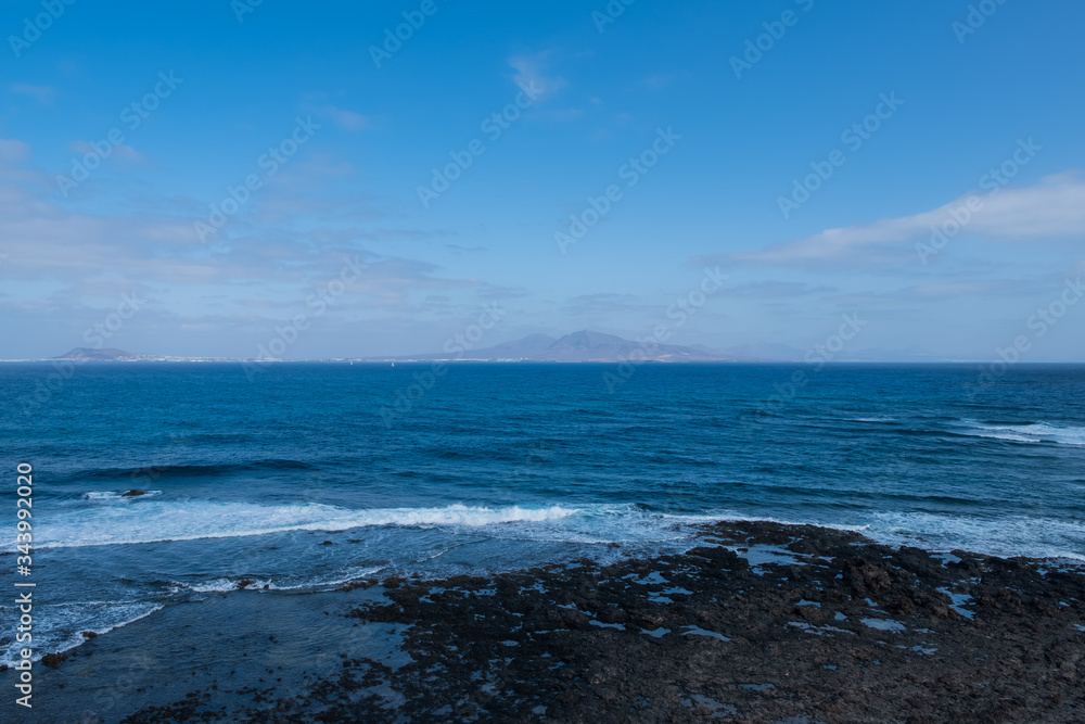 Spanish View Landscape from Isla de los Lobos on Lanzarote island Tropical Volcanic Canary Islands Spain. October 2019 Spanish View Landscape from Isla de los Lobos on Lanzarote island Tropical Volcanic Canary Islands Spain. October 2019