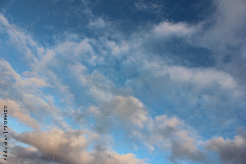 The photo shows clouds against a blue sky