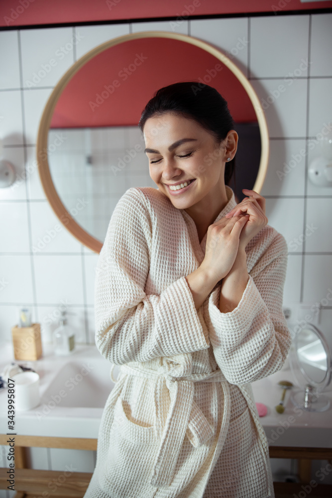 Cheerful woman relaxing in bathroom stock photo Cheerful woman relaxing in bathroom stock photo