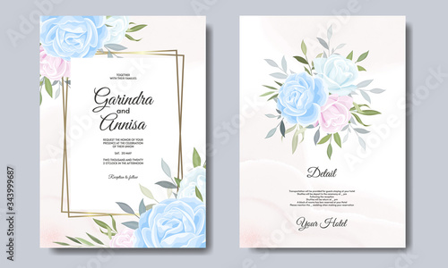 Elegant wedding invitation card with beautiful flower and leaves premium vector