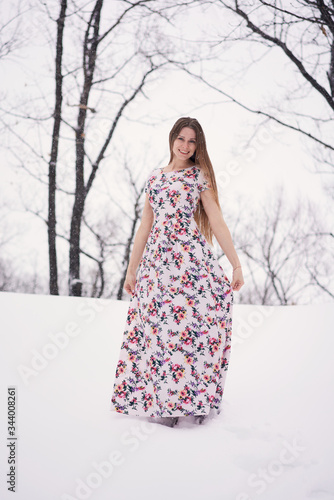 Smiling young woman outdoors on the snow