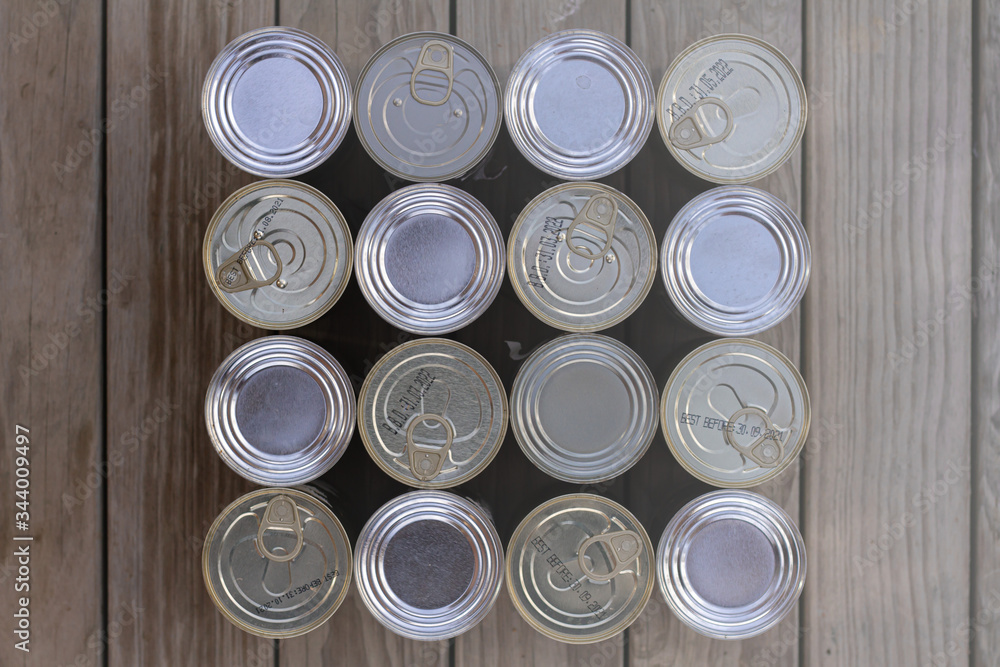 A neatly organised selection of un-labelled tinned foods. A neatly organised selection of un-labelled tinned foods.