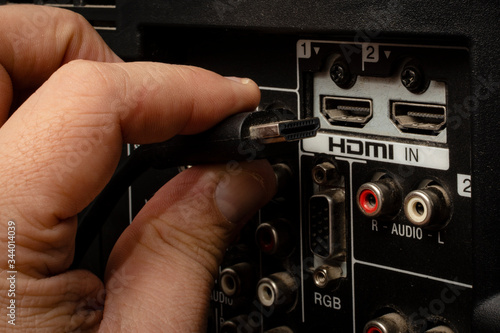 HDMI cable. Plug into the port, back of the TV. Technology. Connector to transmit high definition image.