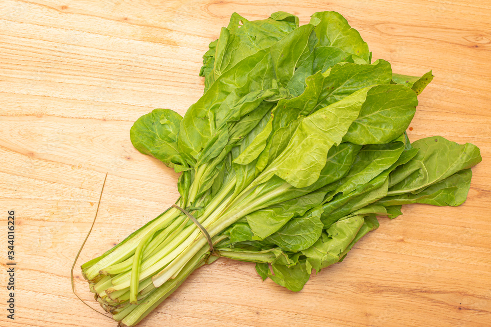 Fresh chard on wooden table. Healthy food, natural life. Fresh vegetables for consumption.