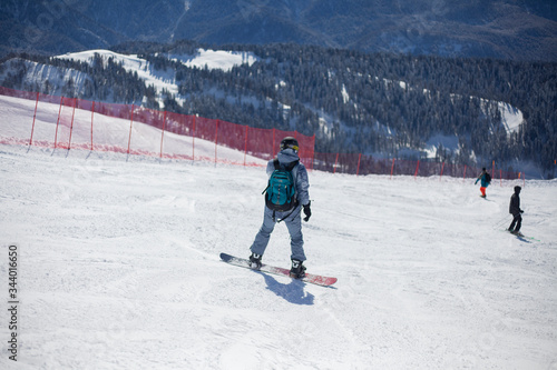 Snowboarder on a snowy slope.