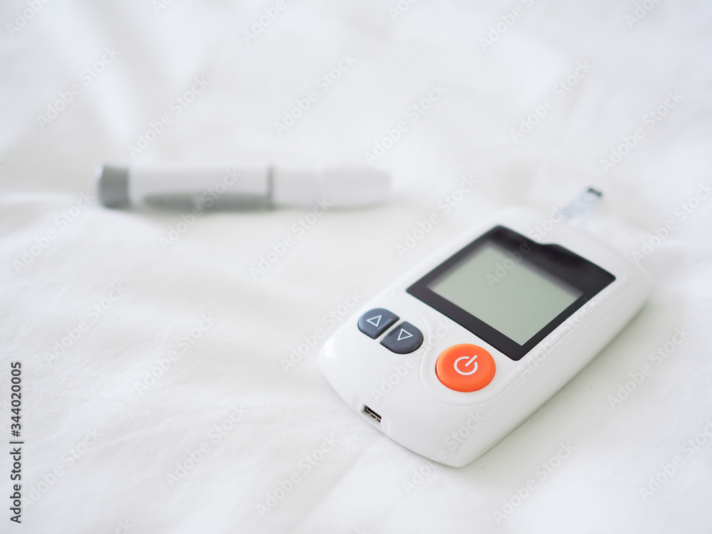 Blood glucose checking device.Concept of a healthy diabetic. Blood glucose checking device.Concept of a healthy diabetic.