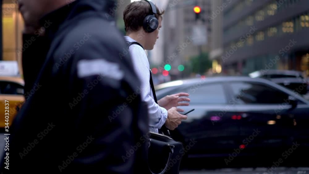 Handsome corporate director in blue shirt using 4g wireless on mobile gadget for listen online music podcast, slow motion effect of millennial man in headphones for noise cancellation
Handsome corporate director in blue shirt using 4g wireless on mobile gadget for listen online music podcast, slow motion effect of millennial man in headphones for noise cancellation