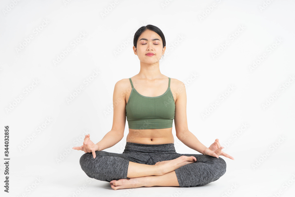Young Asian woman yoga meditating on white background Young Asian woman yoga meditating on white background