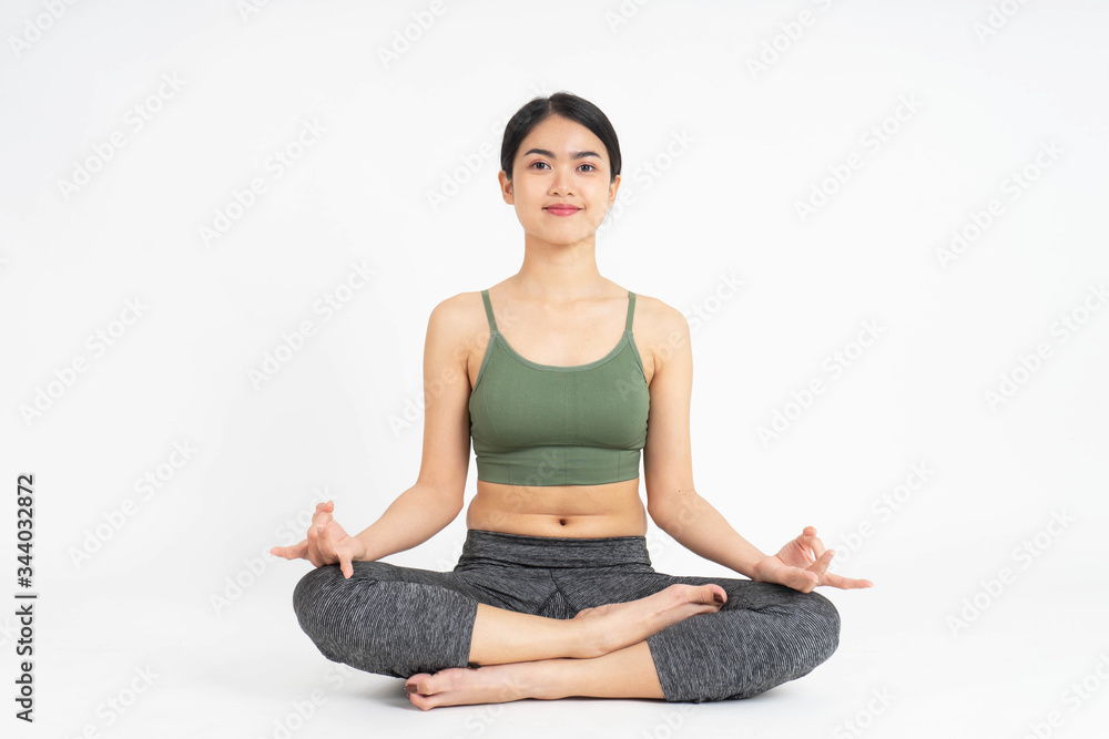 Young Asian woman yoga meditating on white background Young Asian woman yoga meditating on white background