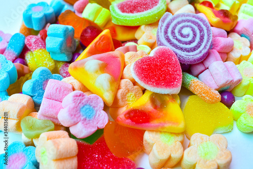 Many colorful lollipops with a sweet flavor placed on the plate.