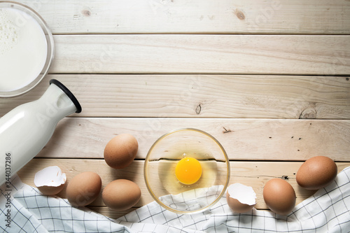 ilk eggs and raw eggs in a glass bowl on the table