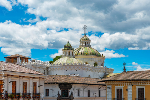 Fototapeta The domes of the Jesuit Compania de Jesus church and colonial style facades in the historic city center of Quito, Ecuador