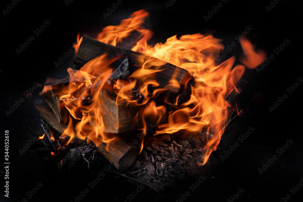 Fire flames with sparks on  coals