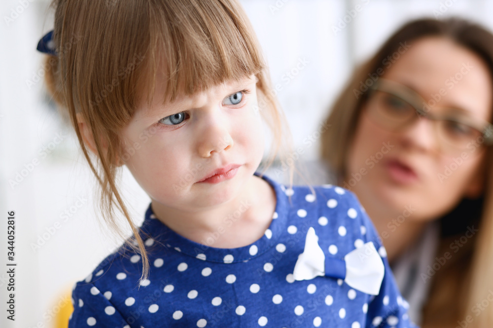 A small child is afraid in the hospital room. The doctor holds his hands and soothes the portrait. A small child is afraid in the hospital room. The doctor holds his hands and soothes the portrait.