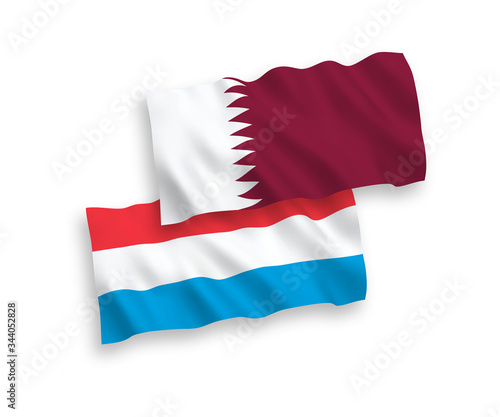Flags of Qatar and Luxembourg on a white background
