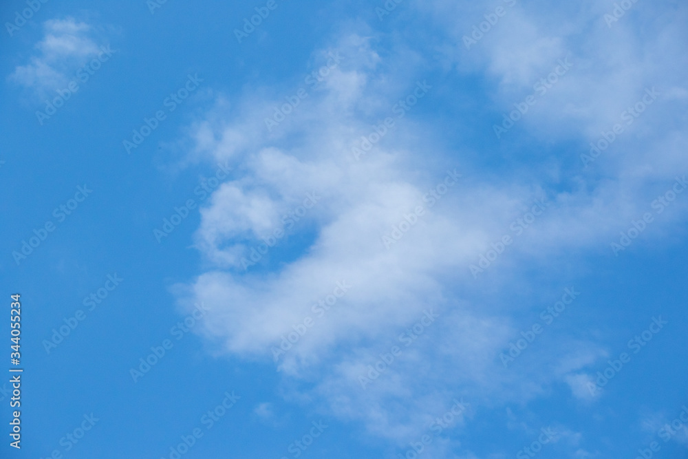 White clouds isolated in a clear cold blue sky on the Highveld of South Africa image for background use White clouds isolated in a clear cold blue sky on the Highveld of South Africa image for background use