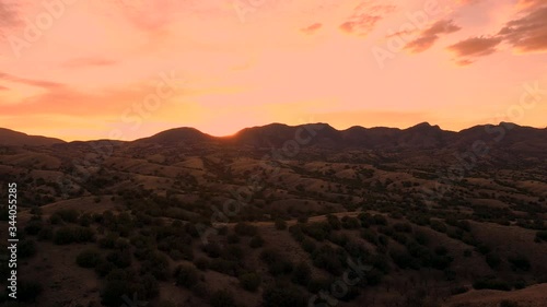 Beautiful Sun Setting Over Santa Rita Mountain Range In Sonoita, Arizona - Wide Shot photo