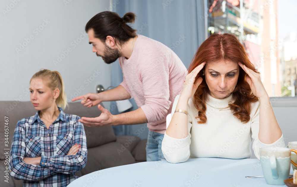 Obraz premium Sad mature woman sitting after conflict with adult children in home