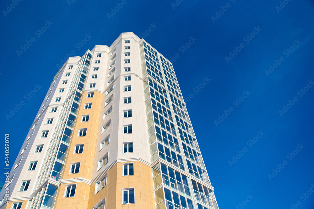 the top of a skyscraper against the blue sky