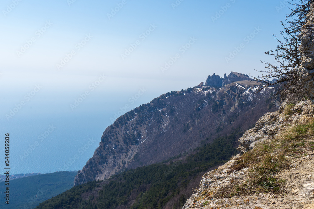 Image of a mountain peak by the sea.