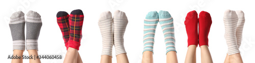 Legs of young women in different socks on white background photo
