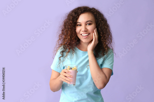 Young woman with tasty yogu...